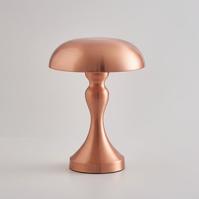 Lampe à poser design en métal rose brossé de style champignon avec pied incurvé, luminaire décoratif moderne pour salon ou table de chevet.